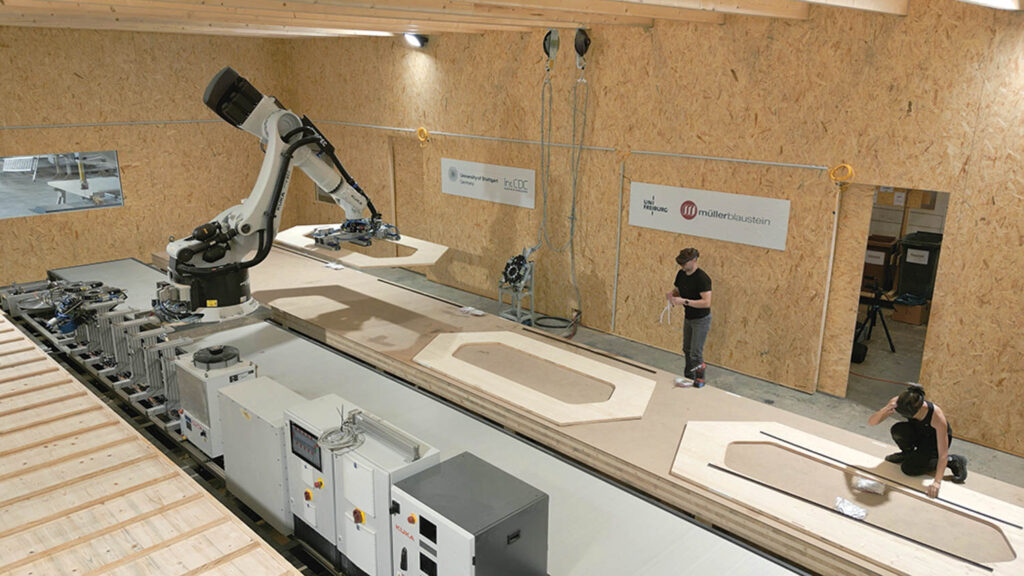 工人们使用AR头饰和机器人构建展览模块